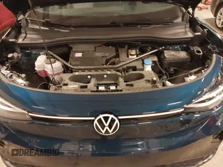 2023 Volkswagen ID.4 Pro z VIN 1V2DNPE84PC038042, wystawiony jako IAAI lot #41446269 z przebiegiem 12 878 mil mil oraz . Historia ofert i sprzedaży dostępna na DreamBid. Obrazek 10.