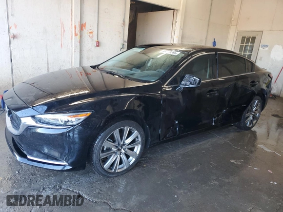 2021 Mazda 6 Carbon Edition with VIN JM1GL1WY9M1605756, listed as a Copart auction lot 46778355 with 60,063 mi miles and Salvage Title. Bid and sale history available at DreamBid. Image 1.