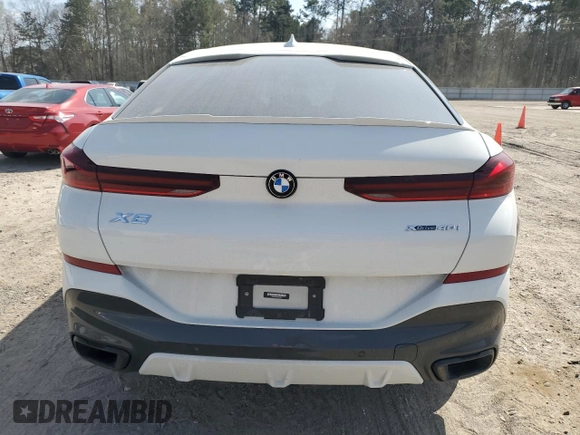 2022 BMW X6 xDrive40i z VIN 5UXCY6C0XN9K78927, wystawiony jako Copart lot #48348335 z przebiegiem 63 074 mil mil oraz Szkoda całkowita • Salvage title. Historia ofert i sprzedaży dostępna na DreamBid. Obrazek 6.