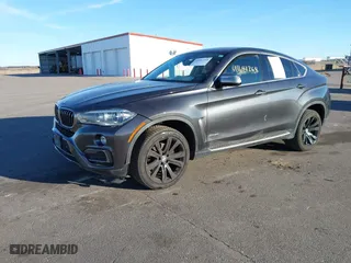 2015 BMW X6 xDrive35i with VIN 5UXKU2C50F0N77926, listed as a IAAI auction lot 41681268 with 136,118 mi miles. Bid and sale history available at carsss.com. Image 2.