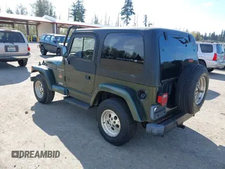 1997 Jeep Wrangler Sahara with VIN 1J4FY49S4VP523156, listed as a IAAI auction lot 42046797 with 193,408 mi miles. Bid and sale history available at carsss.com. Image 3.