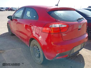 2012 Kia Rio LX with VIN KNADM5A35C6058809, listed as a IAAI auction lot 42052025 with 124,266 mi miles. Bid and sale history available at carsss.com. Image 3.