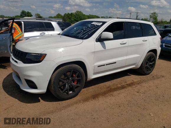 2018 Jeep Grand Cherokee with VIN NJ1449E, listed as a Copart auction lot 51357834 with 32,619 mi miles and Salvage title. Bid and sale history available at DreamBid. Image 1.