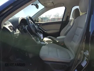 2014 Mazda CX-5 Touring with VIN JM3KE4CY4E0407868, listed as a Copart auction lot 52564315 with 137,989 mi miles and Salvage Title. Bid and sale history available at carsss.com. Image 7.