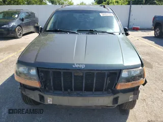 2002 Jeep Grand Cherokee Laredo with VIN 1J4GW48S02C174656, listed as a Copart auction lot 56954155 with 235,427 mi miles and Salvage title. Bid and sale history available at DreamBid. Image 5.