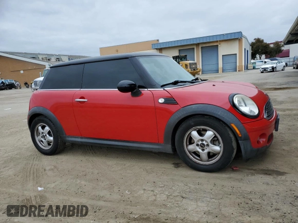 2009 MINI Hardtop with VIN WMWMF33519TW77558, listed as a Copart auction lot 54556785 with 97,749 mi miles and Salvage Title. Bid and sale history available at DreamBid. Image 4.