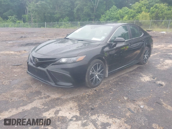 2023 Toyota Camry SE with VIN 4T1G11AKXPU827360, listed as a IAAI auction lot 42217356 with 57,497 mi miles and . Bid and sale history available at DreamBid. Image 17.