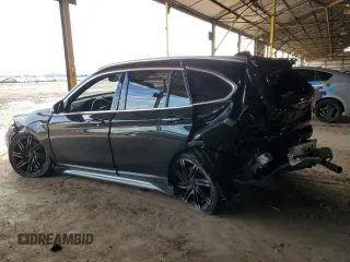 2018 BMW X1 sDrive28i with VIN WBXHU7C34J5L05725, listed as a Copart auction lot 49228475 with 69,994 mi miles and Salvage Title. Bid and sale history available at carsss.com. Image 2.
