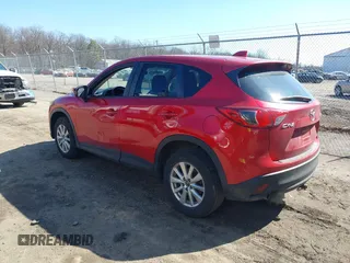 2014 Mazda CX-5 Touring with VIN JM3KE2CY2E0374440, listed as a IAAI auction lot 41634144 with 106,145 mi miles and . Bid and sale history available at DreamBid. Image 3.