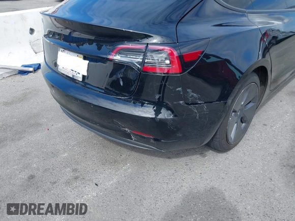 2022 Tesla Model 3 with VIN 5YJ3E1EA7NF314744, listed as a IAAI auction lot 42057596 with 30,936 mi miles and . Bid and sale history available at DreamBid. Image 19.
