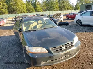2000 Honda Accord EX z VIN JHMCG5659YC033886, wystawiony jako Copart lot #87952845 z przebiegiem 317 730 mil mil oraz Szkoda całkowita • Salvage title. Historia ofert i sprzedaży dostępna na DreamBid. Obrazek 11.
