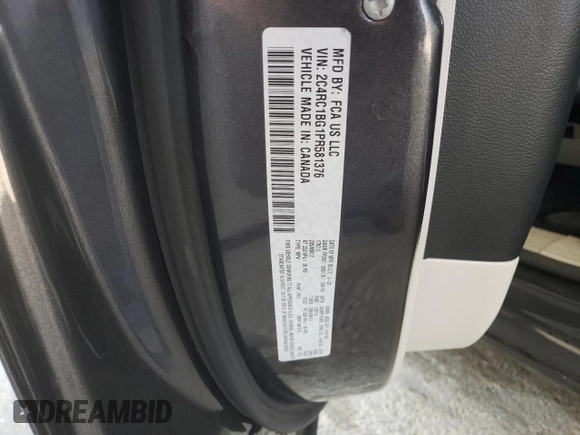 2023 Chrysler Pacifica Touring L with VIN 2C4RC1BG1PR581376, listed as a Copart auction lot 59901915 with 57,411 mi miles and Salvage title. Bid and sale history available at DreamBid. Image 14.