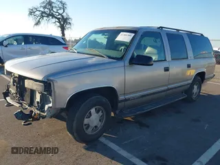 1999 GMC Suburban with VIN 1GKEC16R8XJ737397, listed as a IAAI auction lot 41301399 with 115,481 mi miles. Bid and sale history available at carsss.com. Image 2.
