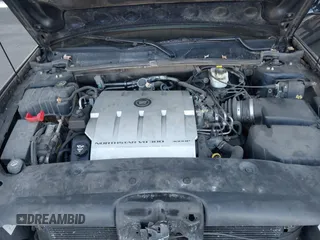 2004 Cadillac DeVille DTS z VIN 1G6KF57934U181654, wystawiony jako IAAI lot #41752298 z przebiegiem 131 861 mil mil oraz . Historia ofert i sprzedaży dostępna na DreamBid. Obrazek 10.