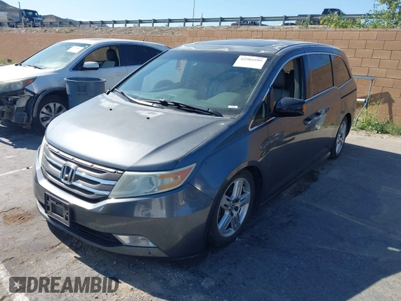 2011 Honda Odyssey Touring with VIN 5FNRL5H96BB009580, listed as a IAAI auction lot 42202595 with Not provided miles and . Bid and sale history available at DreamBid. Image 17.