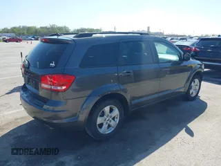 2014 Dodge Journey SE with VIN 3C4PDCAB7ET136799, listed as a IAAI auction lot 41972348 with 163,357 mi miles. Bid and sale history available at carsss.com. Image 4.