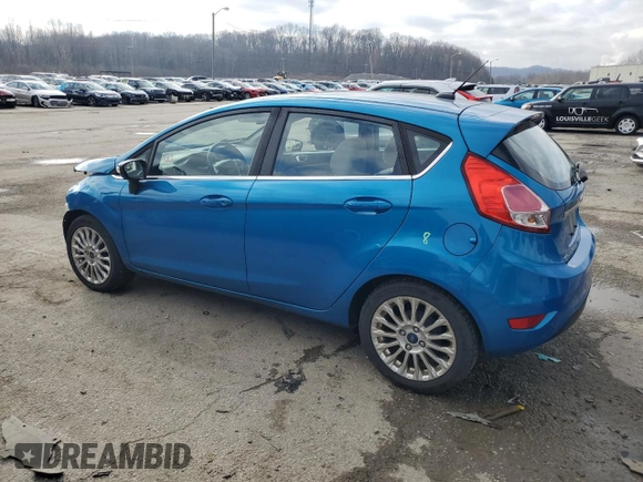 2015 Ford Fiesta Titanium z VIN 3FADP4FJ7FM120958, wystawiony jako Copart lot #85260204 z przebiegiem 144 587 mil mil oraz Szkoda całkowita • Salvage title. Historia ofert i sprzedaży dostępna na DreamBid. Obrazek 2.