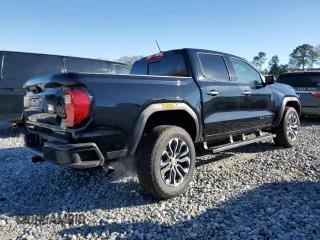 2024 GMC Canyon 4WD Denali with VIN 1GTP6FEK2R1190966, listed as a Copart auction lot 87812495 with 2,143 mi miles and Salvage Title. Bid and sale history available at carsss.com. Image 3.