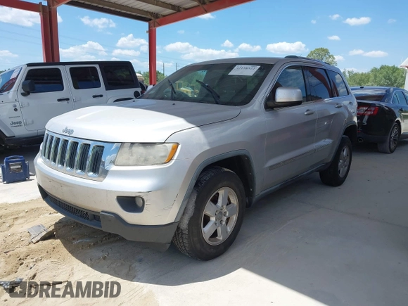 2011 Jeep Grand Cherokee Laredo with VIN 1J4RR4GG3BC540655, listed as a IAAI auction lot 42158522 with 214,341 mi miles and . Bid and sale history available at DreamBid. Image 2.