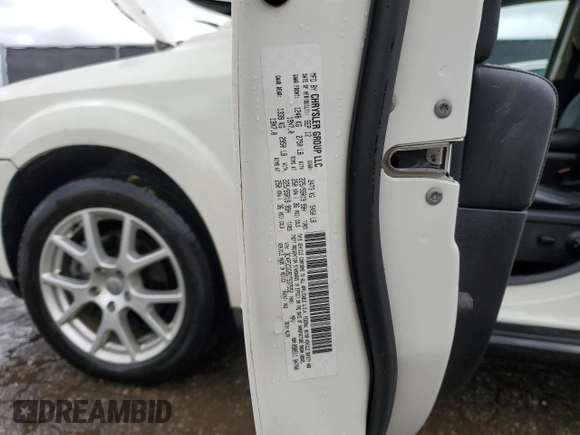 2013 Dodge Journey Crew with VIN 3C4PDCDG9DT537552, listed as a Copart auction lot 58126615 with 96,884 mi miles and Salvage title. Bid and sale history available at DreamBid. Image 13.