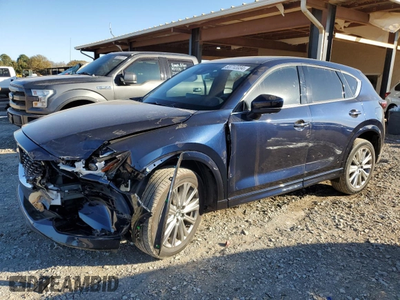 2023 Mazda CX-5 Signature with VIN JM3KFBXY1P0122544, listed as a Copart auction lot 83712034 with 27,032 mi miles and Salvage Title. Bid and sale history available at DreamBid. Image 1.