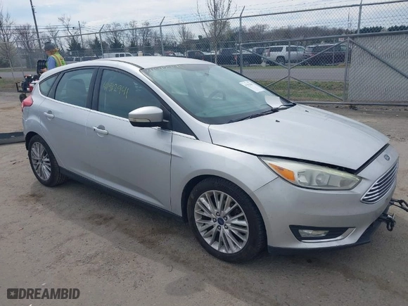 2015 Ford Focus Titanium with VIN 1FADP3N27FL228549, listed as a IAAI auction lot 41912941 with 69,025 mi miles. Bid and sale history available at carsss.com. Image 1.