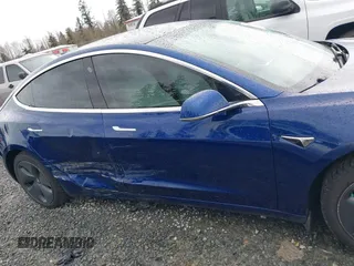 2019 Tesla Model 3 Long Range with VIN 5YJ3E1EB8KF512950, listed as a IAAI auction lot 41836349 with 55,607 mi miles and . Bid and sale history available at DreamBid. Image 13.