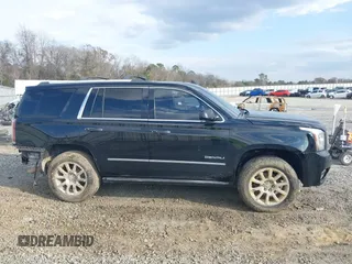 2015 GMC Yukon Denali with VIN 1GKS1CKJ8FR612971, listed as a IAAI auction lot 41519689 with 197,003 mi miles. Bid and sale history available at carsss.com. Image 13.
