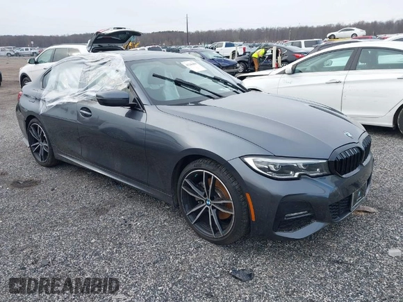 2019 BMW 3 Series 330i xDrive with VIN WBA5R7C54KFH24284, listed as a IAAI auction lot 41246406 with 57,200 mi miles. Bid and sale history available at carsss.com. Image 1.