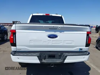 2023 Ford F-150 Lightning Pro with VIN 1FTVW1EL4PWG42578, listed as a IAAI auction lot 41992446 with 26,729 mi miles and . Bid and sale history available at DreamBid. Image 16.