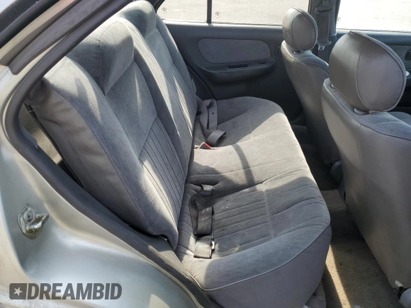 1996 Nissan Sentra XE z VIN 3N1AB41D5TL010573, wystawiony jako Copart lot #47284155 z przebiegiem 158 185 mil mil oraz Szkoda całkowita • Salvage title. Historia ofert i sprzedaży dostępna na DreamBid. Obrazek 10.