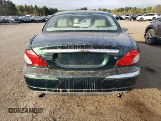 2004 Jaguar X-Type z VIN SAJEA51C04WD65097, wystawiony jako Copart lot #53825295 z przebiegiem 58 270 mil mil oraz Szkoda całkowita • Salvage title. Historia ofert i sprzedaży dostępna na DreamBid. Obrazek 6.