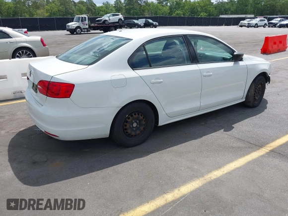 2014 Volkswagen Jetta Sedan S with VIN 3VW2K7AJ6EM334635, listed as a IAAI auction lot 42151738 with 142,923 mi miles. Bid and sale history available at carsss.com. Image 4.