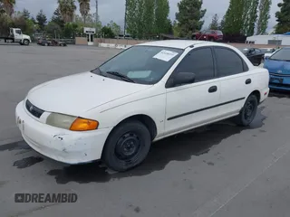 1997 Mazda Protege DX with VIN JM1BC1417V0156858, listed as a IAAI auction lot 42118339 with 187,673 mi miles and . Bid and sale history available at DreamBid. Image 2.