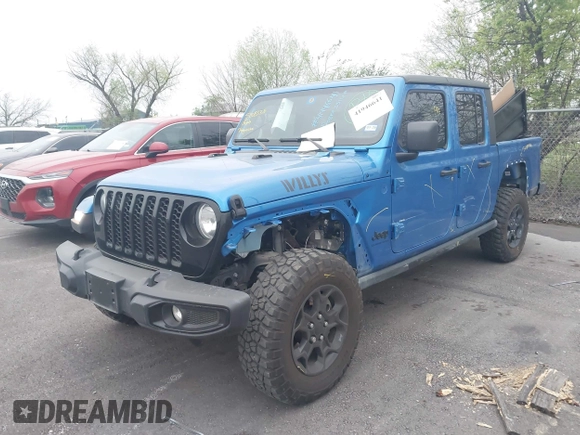 2023 Jeep Gladiator Sport S z VIN 1C6HJTAG6PL579136, wystawiony jako IAAI lot #41946641 z przebiegiem 14 856 mil mil oraz . Historia ofert i sprzedaży dostępna na DreamBid. Obrazek 2.
