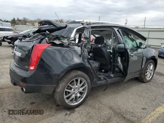 2014 Cadillac SRX Premium Collection z VIN 3GYFNGE31ES688270, wystawiony jako Copart lot #52795245 z przebiegiem 134 103 mil mil oraz Szkoda całkowita • Salvage title. Historia ofert i sprzedaży dostępna na DreamBid. Obrazek 3.