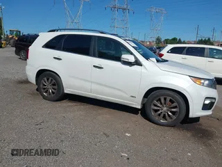 2012 Kia Sorento SX z VIN 5XYKWDA21CG253986, wystawiony jako IAAI lot #42405849 z przebiegiem 218 540 mil mil oraz . Historia ofert i sprzedaży dostępna na DreamBid. Obrazek 1.