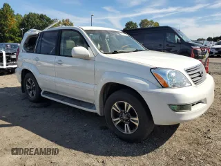 2004 Lexus GX 470 with VIN JTJBT20XX40033938, listed as a Copart auction lot 70871164 with 214,565 mi miles and Salvage Title. Bid and sale history available at carsss.com. Image 4.