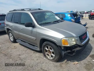 2003 GMC Envoy SLE z VIN 1GKDT13S632213799, wystawiony jako IAAI lot #42470437 z przebiegiem 289 728 mil mil oraz . Historia ofert i sprzedaży dostępna na DreamBid. Obrazek 1.