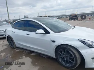 2021 Tesla Model 3 Long Range with VIN 5YJ3E1EB9MF059554, listed as a IAAI auction lot 41231520 with 63,696 mi miles and . Bid and sale history available at DreamBid. Image 12.