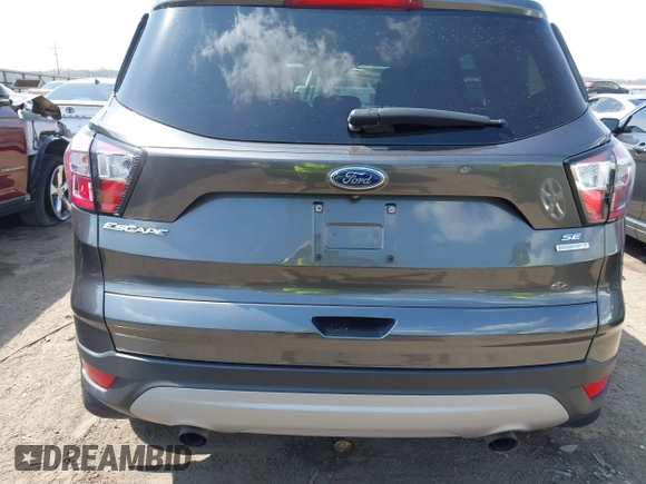 2017 Ford Escape SE z VIN 1FMCU0GD9HUD28110, wystawiony jako IAAI lot #41903505 z przebiegiem 66 808 mil mil oraz . Historia ofert i sprzedaży dostępna na DreamBid. Obrazek 17.