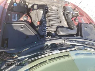 1999 Jaguar XK z VIN SAJGX2043XC032962, wystawiony jako Copart lot #49312155 z przebiegiem 74 662 mil mil oraz Szkoda całkowita • Salvage title. Historia ofert i sprzedaży dostępna na DreamBid. Obrazek 11.