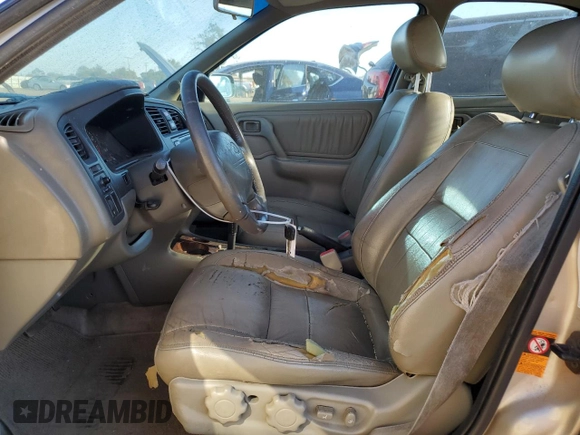 2001 Infiniti G20 Luxury z VIN JNKCP11A01T400404, wystawiony jako Copart lot #69899274 z przebiegiem 243 332 mil mil oraz Szkoda całkowita • Salvage title. Historia ofert i sprzedaży dostępna na DreamBid. Obrazek 7.