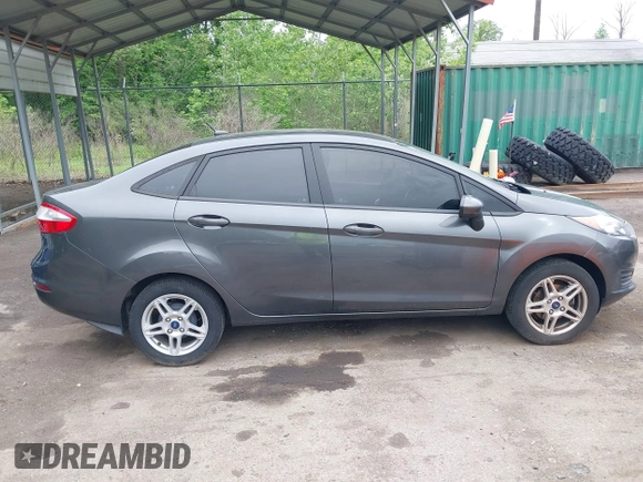 2019 Ford Fiesta SE z VIN 3FADP4BJ7KM155094, wystawiony jako IAAI lot #42186126 z przebiegiem 93 684 mil mil oraz . Historia ofert i sprzedaży dostępna na DreamBid. Obrazek 13.