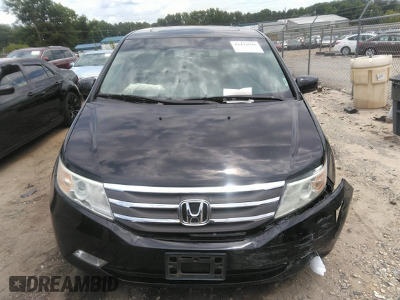 2012 Honda Odyssey Touring with VIN 5FNRL5H97CB066596, listed as a IAAI auction lot 42472935 with 217,182 mi miles and . Bid and sale history available at DreamBid. Image 12.