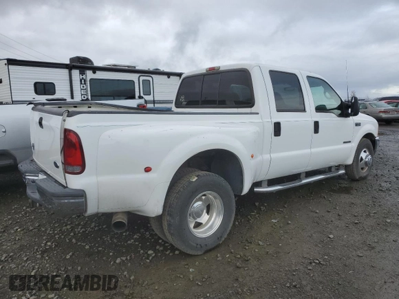 2001 Ford F-350 XL z VIN 1FTWW32F01ED08768, wystawiony jako Copart lot #62873634 z przebiegiem 317 184 mil mil oraz Szkoda całkowita • Salvage title. Historia ofert i sprzedaży dostępna na DreamBid. Obrazek 3.