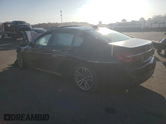 2018 BMW 7 Series 740i xDrive with VIN WBA7E4C53JGV23968, listed as a Copart auction lot 77244814 with 0 mi miles and Salvage Title. Bid and sale history available at carsss.com. Image 2.