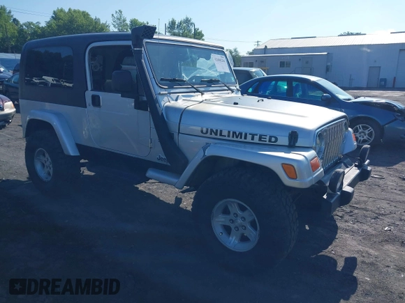 2005 Jeep Wrangler Unlimited with VIN 1J4FA44S55P352803, listed as a IAAI auction lot 42688284 with 128,586 mi miles and . Bid and sale history available at DreamBid. Image 1.