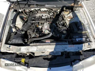 1997 Ford Thunderbird LX with VIN 1FALP62W0VH150654, listed as a Copart auction lot 86274524 with 119,203 mi miles and Salvage Title. Bid and sale history available at DreamBid. Image 12.