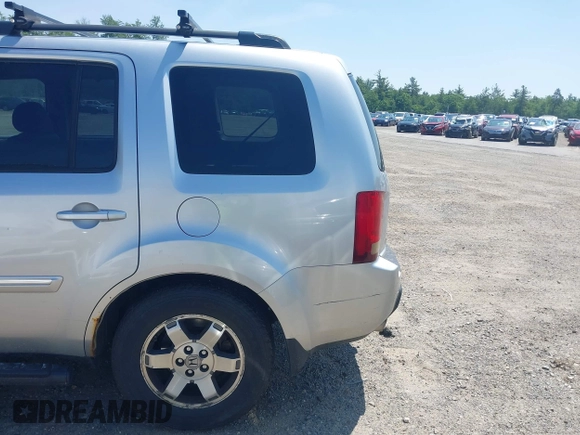 2010 Honda Pilot Touring z VIN 5FNYF4H94AB010058, wystawiony jako IAAI lot #42495313 z przebiegiem 157 306 mil mil oraz . Historia ofert i sprzedaży dostępna na DreamBid. Obrazek 12.